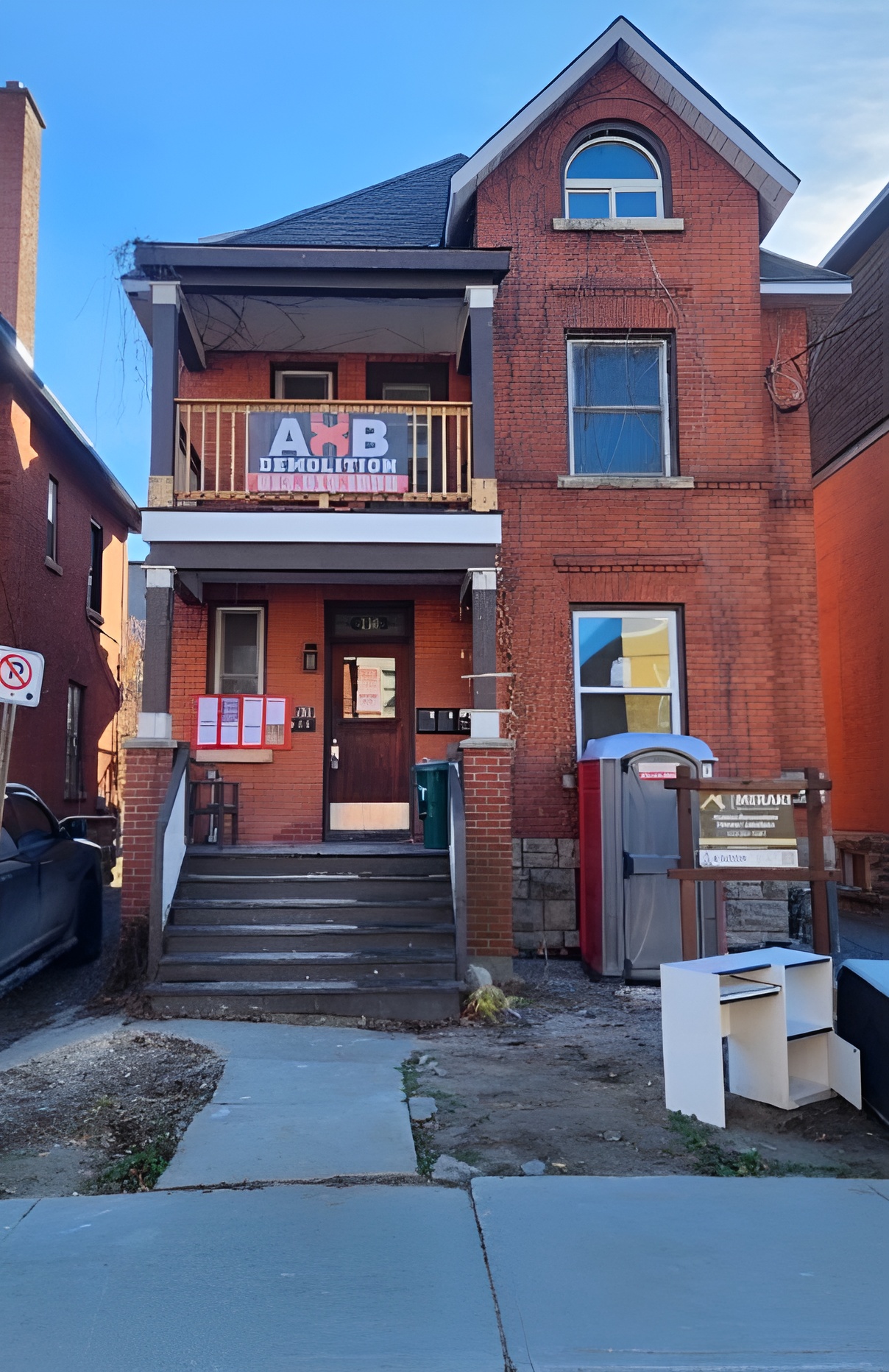 Red brick house with AXB logo
