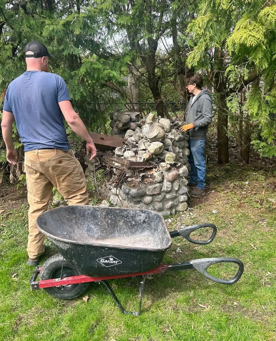 Workers disposing of shed