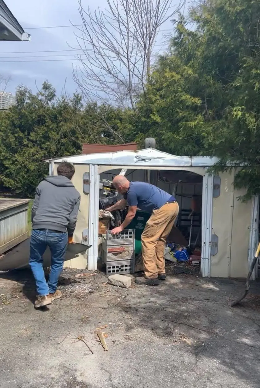 Workers disposing of shed