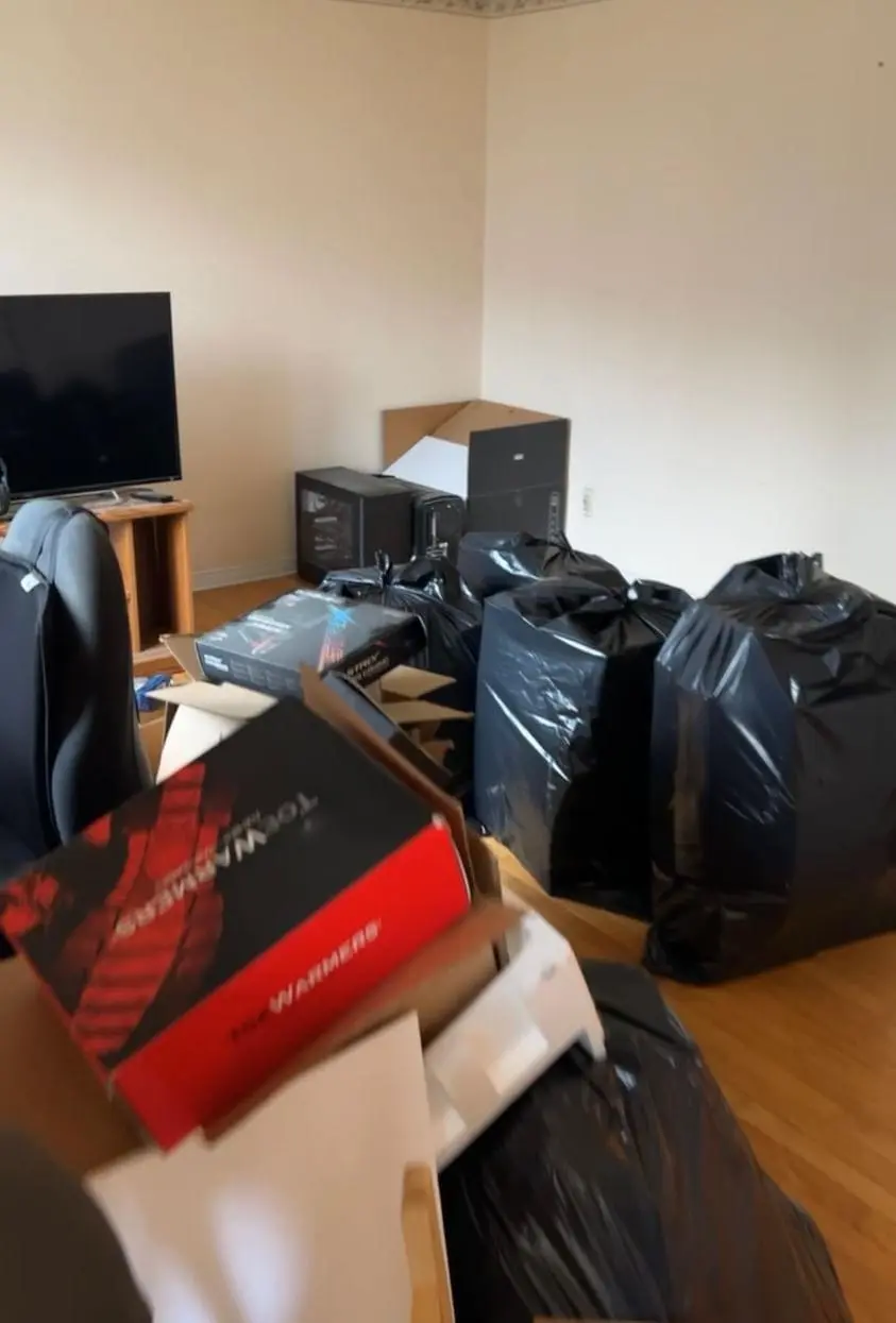 Junk black plastic bags in a room