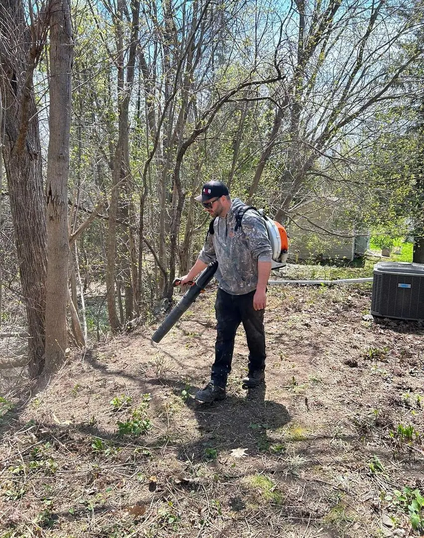 Man blowing leaves